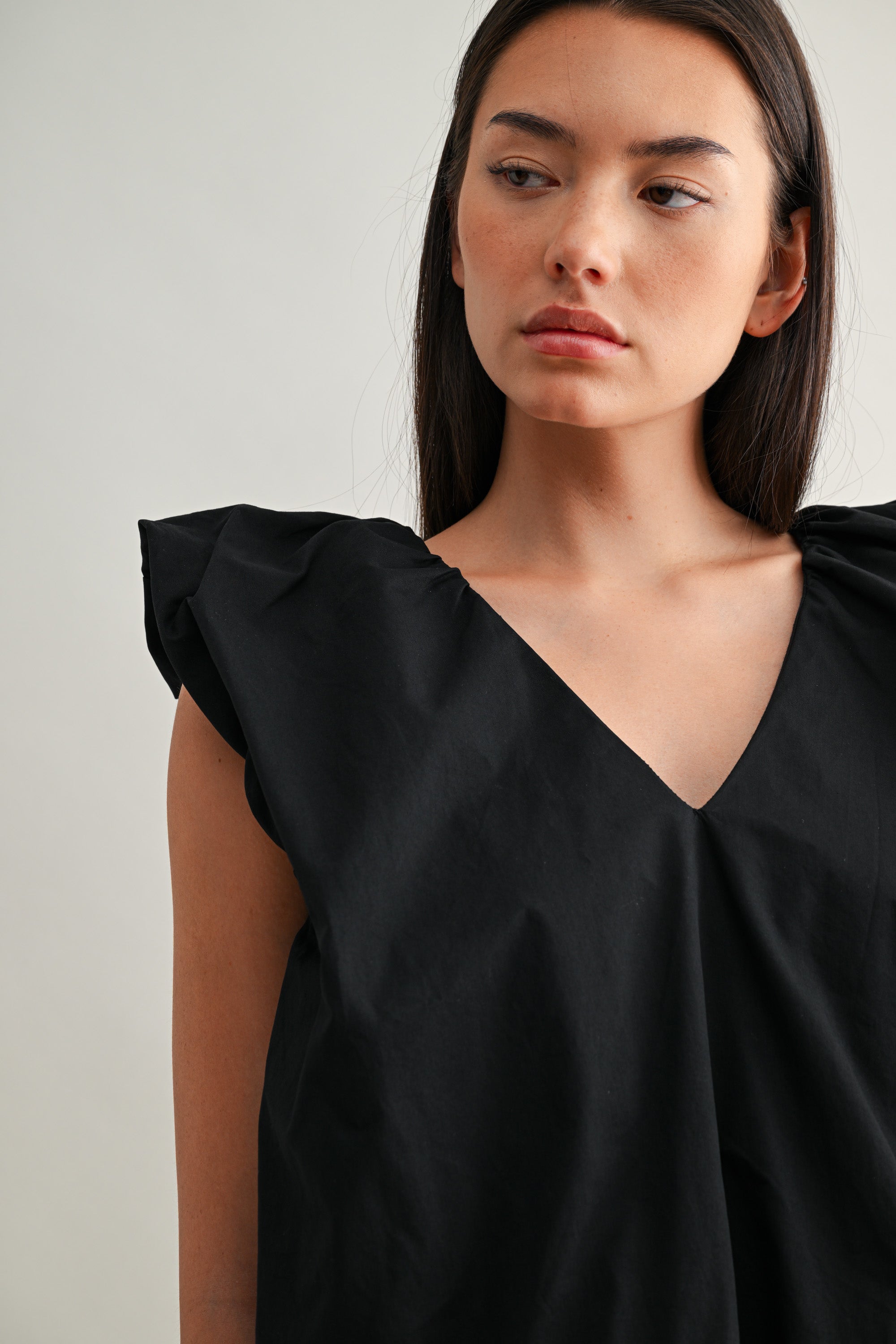 Sleeveless Bubble Hem Deep V Top